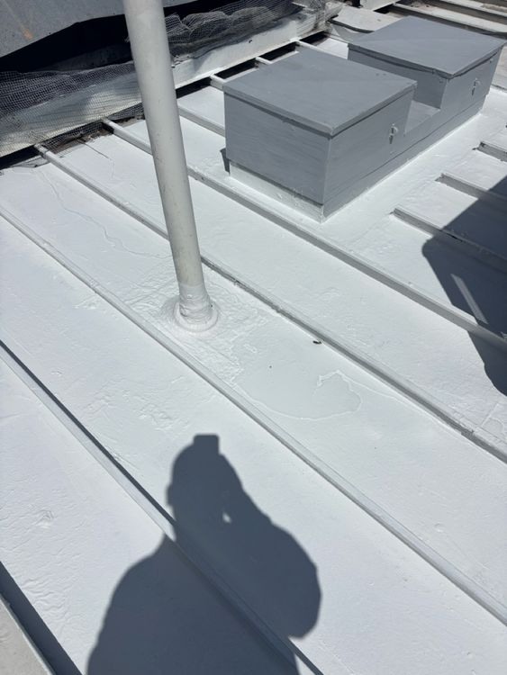 Localized treatment around raised roof details following the repair work.